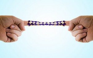A tight, stuck Chinese finger trap, illustrating that by struggling, you may prevent freedom and feeling happy.