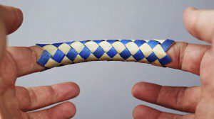 A loose Chinese finger trap, illustrating that by stopping your struggle, you may find freedom and feeling happy