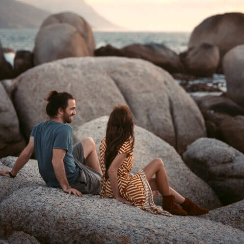 a couple having fun watching the sea